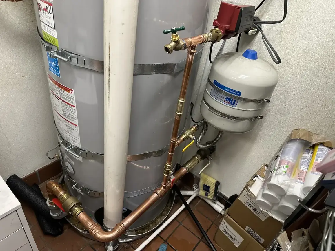 Tank water heater with new expansion tank and copper piping